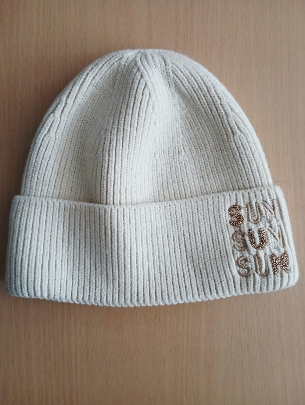 Cream Ribbed Knit Beanie with Embroidered Detail